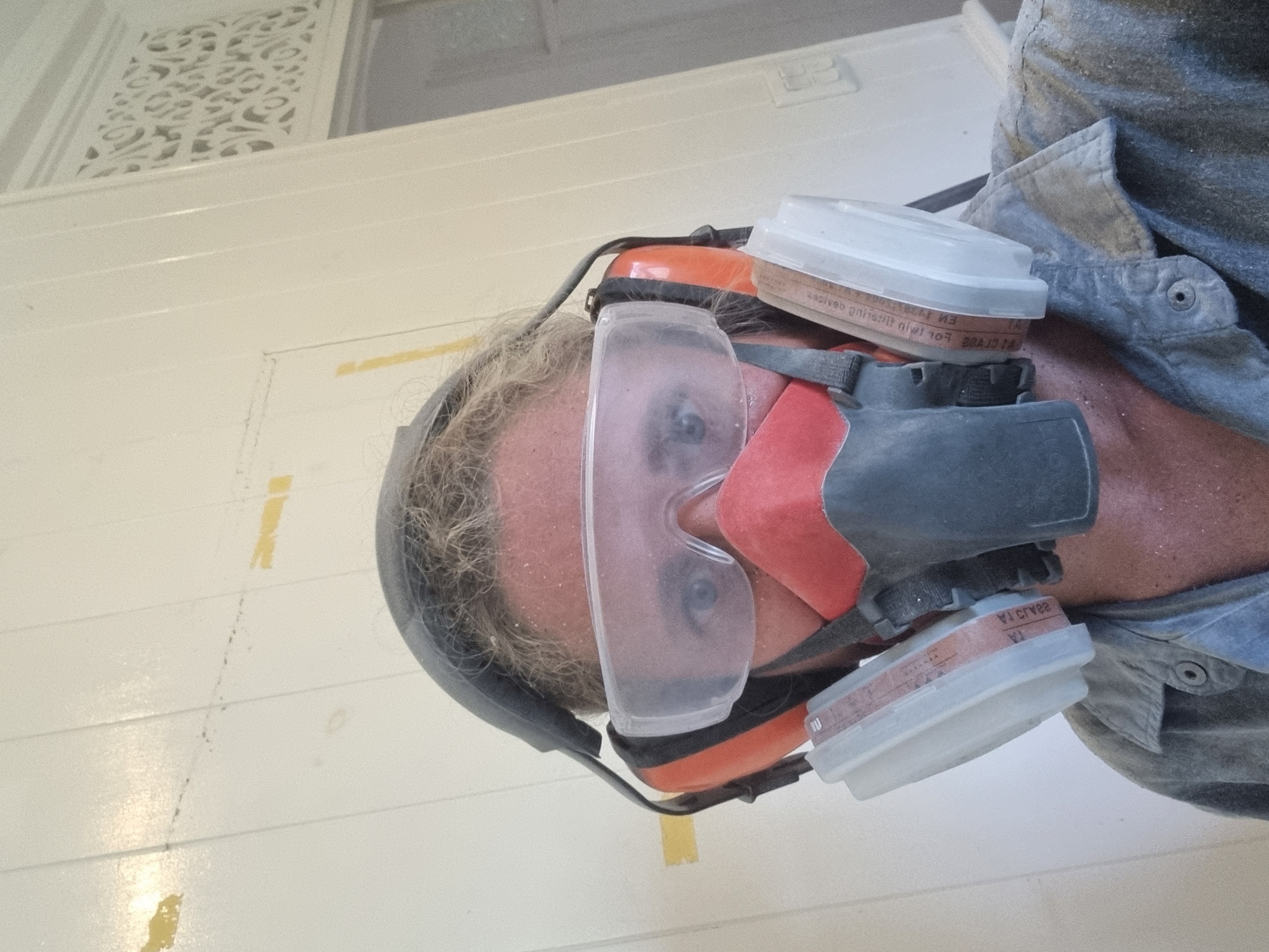 Stacey wearing protective equipment during renovation work